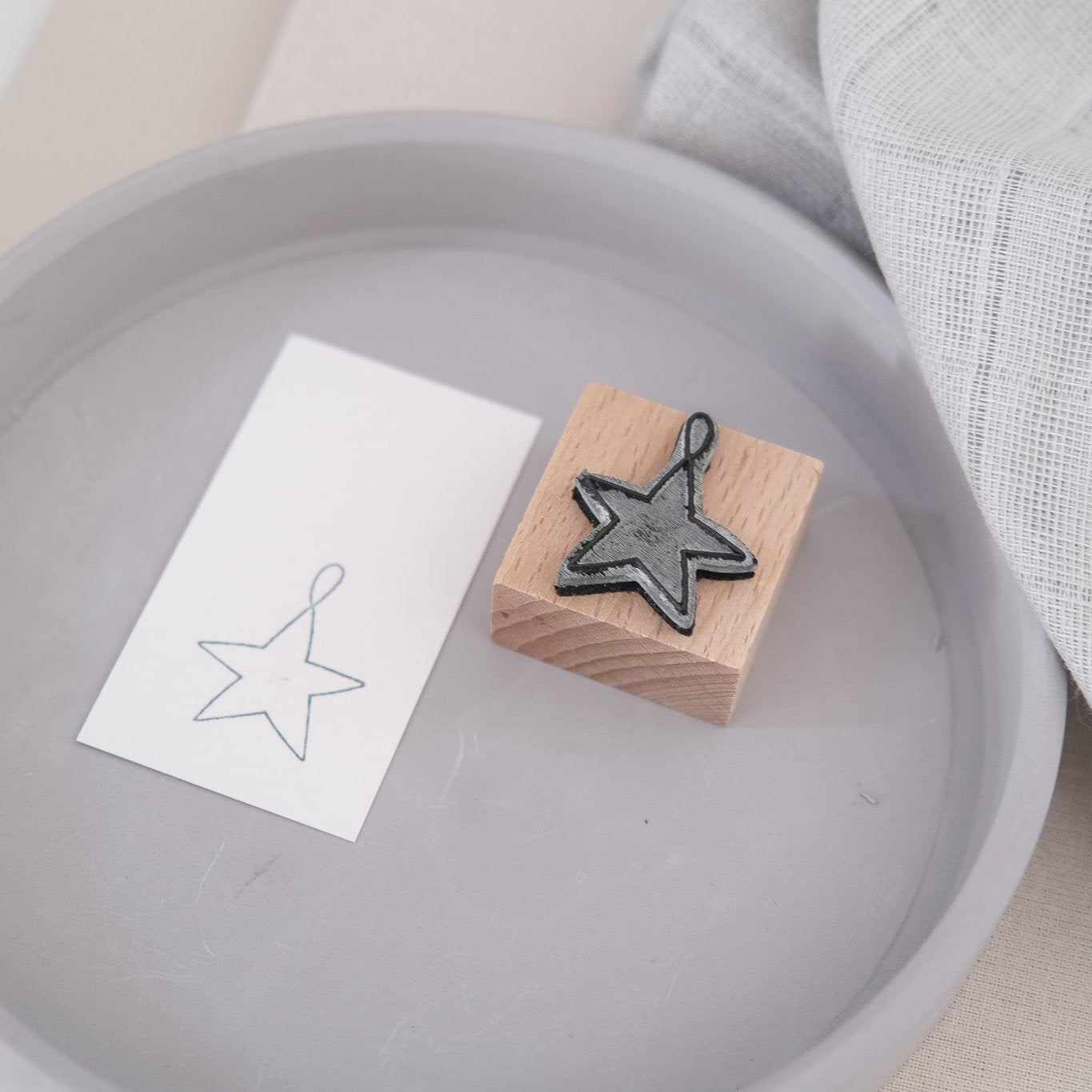 Produktfoto; Holzstempel 3 x 3 cm mit Sternmotiv.