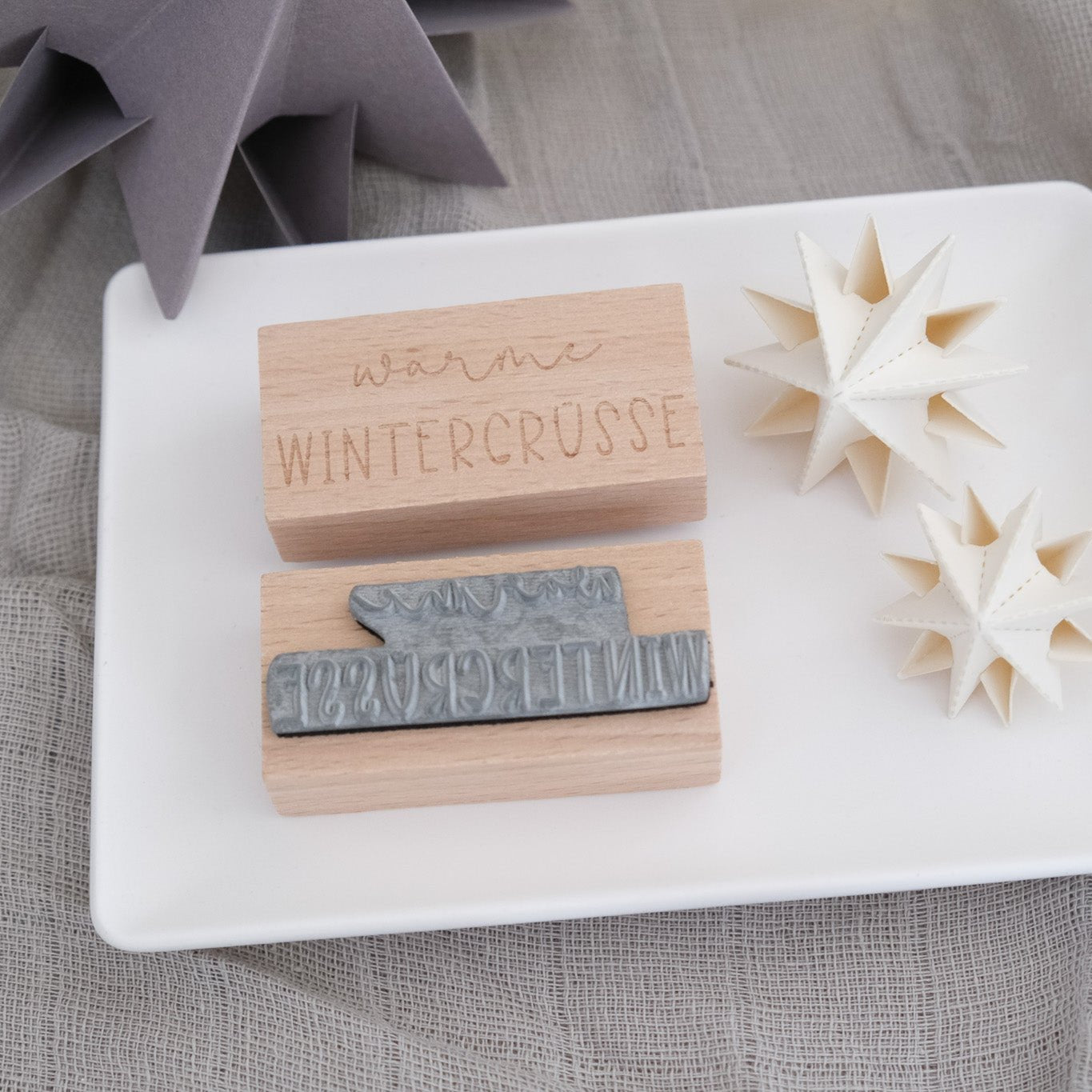 Holzstempel 3 x 6 cm. Mit Text "Warme Wintergrüsse".