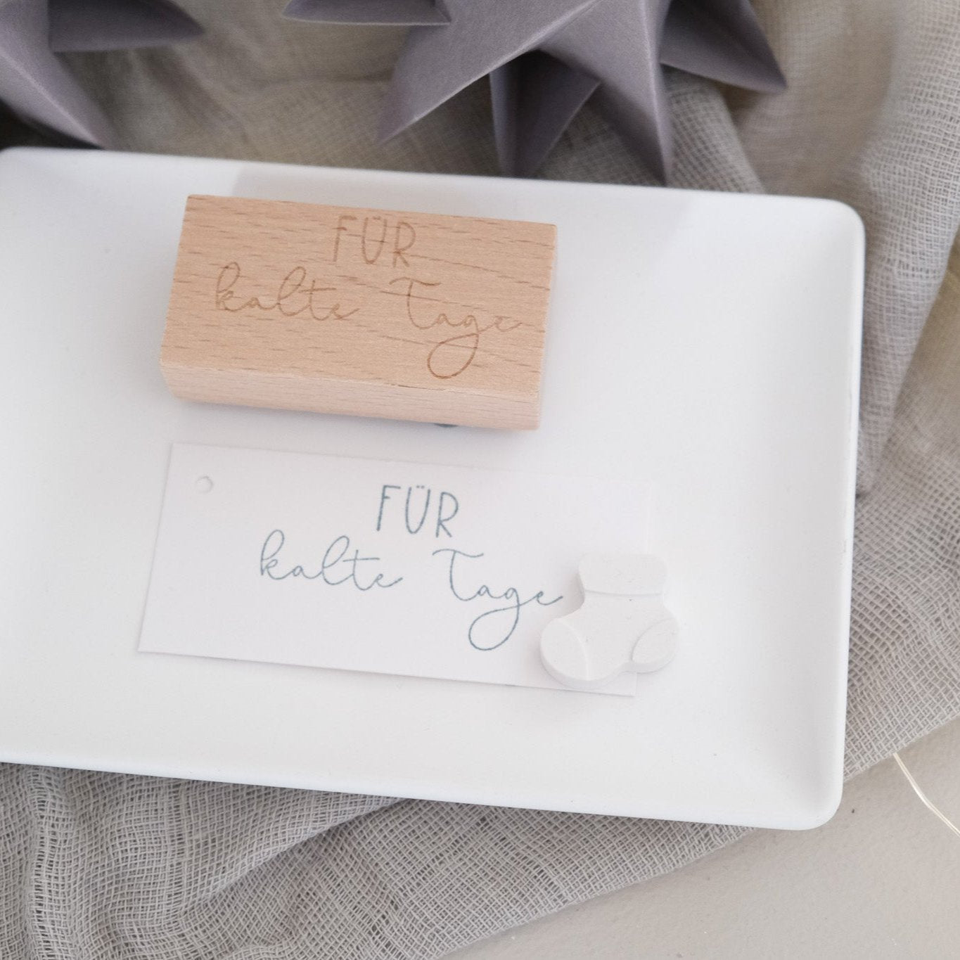 Holzstempel 3 x 6 cm mit dem Text "Für kalte Tage"